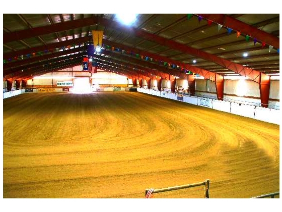 Building contains a 100’ x 200’ riding area, tack room, wash rack, bleacher seating, stocks and commercial kitchen